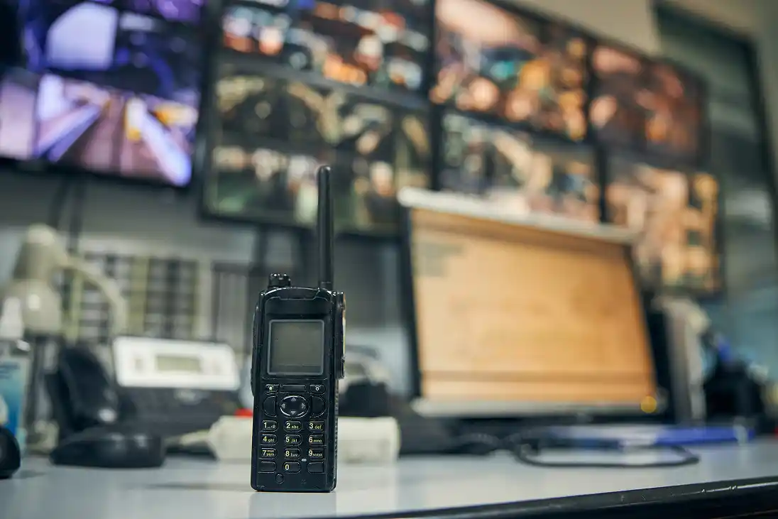walkie-talkie-placed-on-an-office-desk-in-a-contro-2026-01-05-06-15-06-utc 1